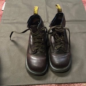 Dr. Marten's leather lace up boots.